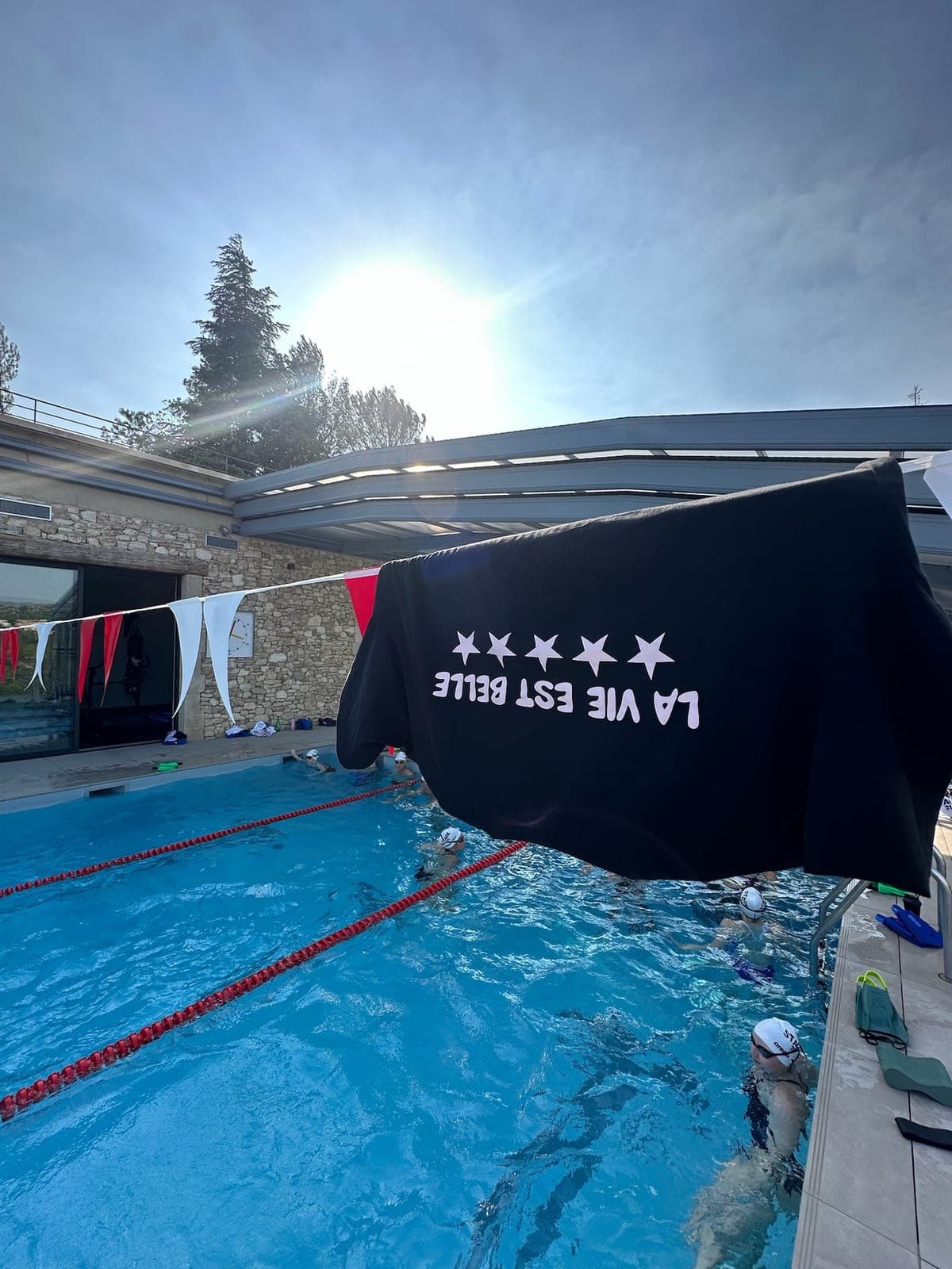 Pool session at the estate in the sun, swimmers and bunting