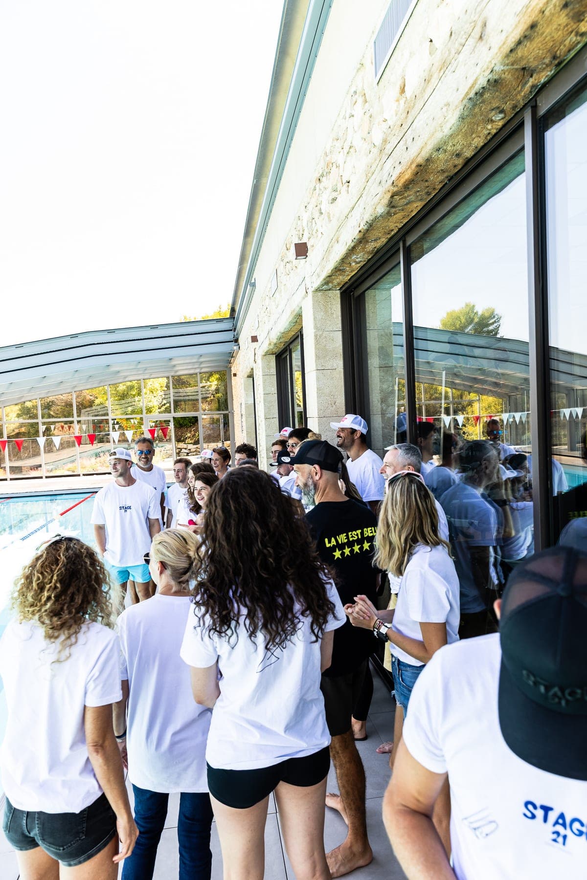 The camp group gathered by the pool