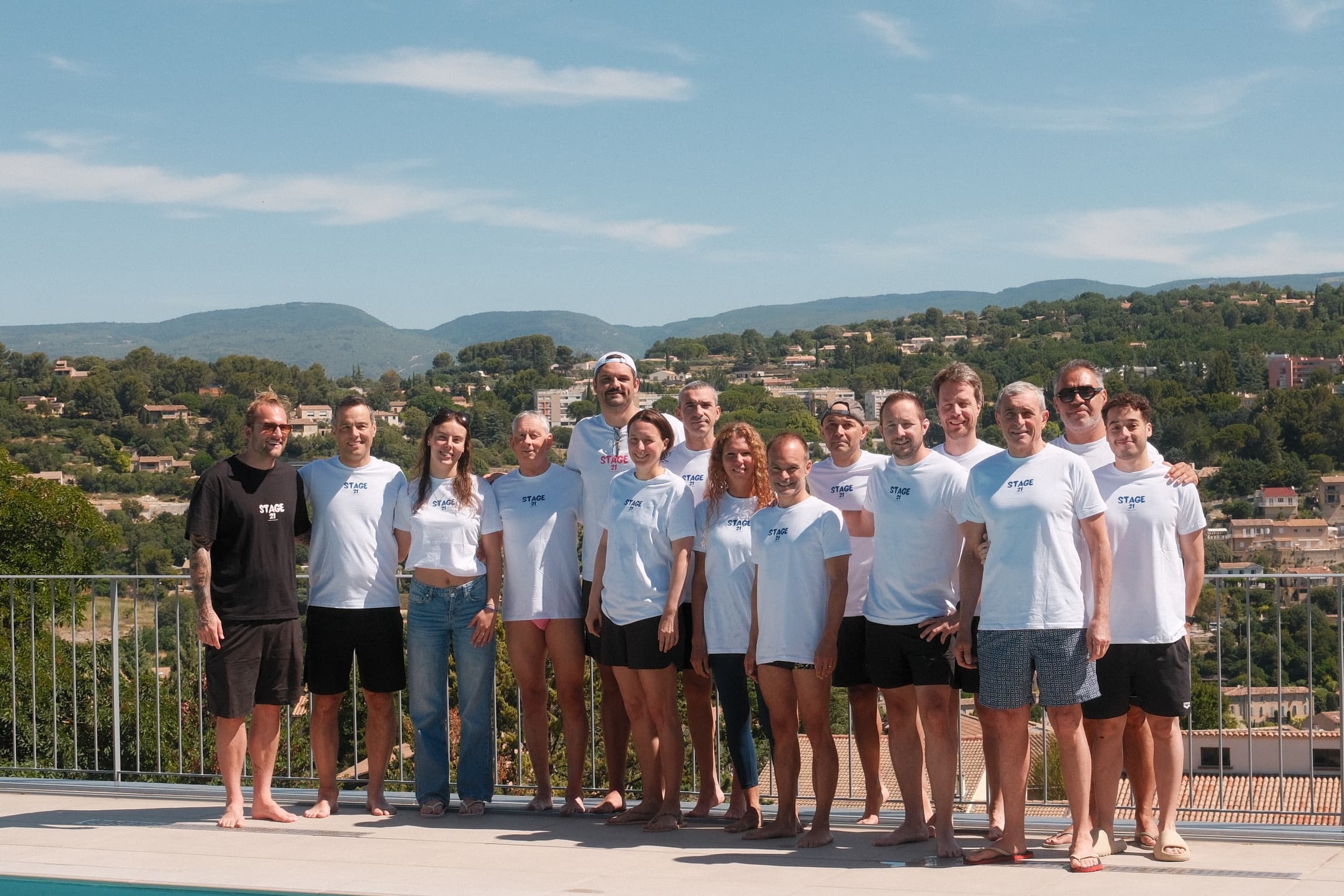 The Stage 21 team gathered by the pool